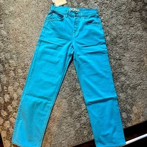 GRLFRND DENIM REVOLVE BLUE MID RISE JEANS.
